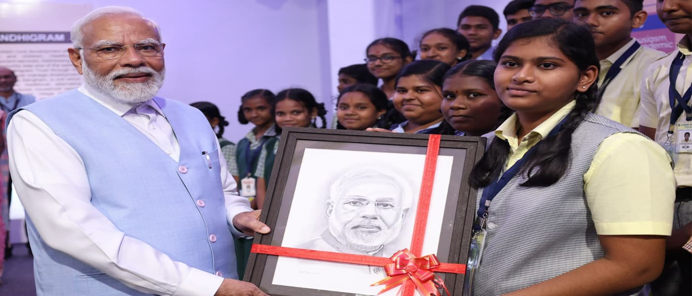 Lakshmi School students present a hand-drawn portrait to the Prime Minister of India
